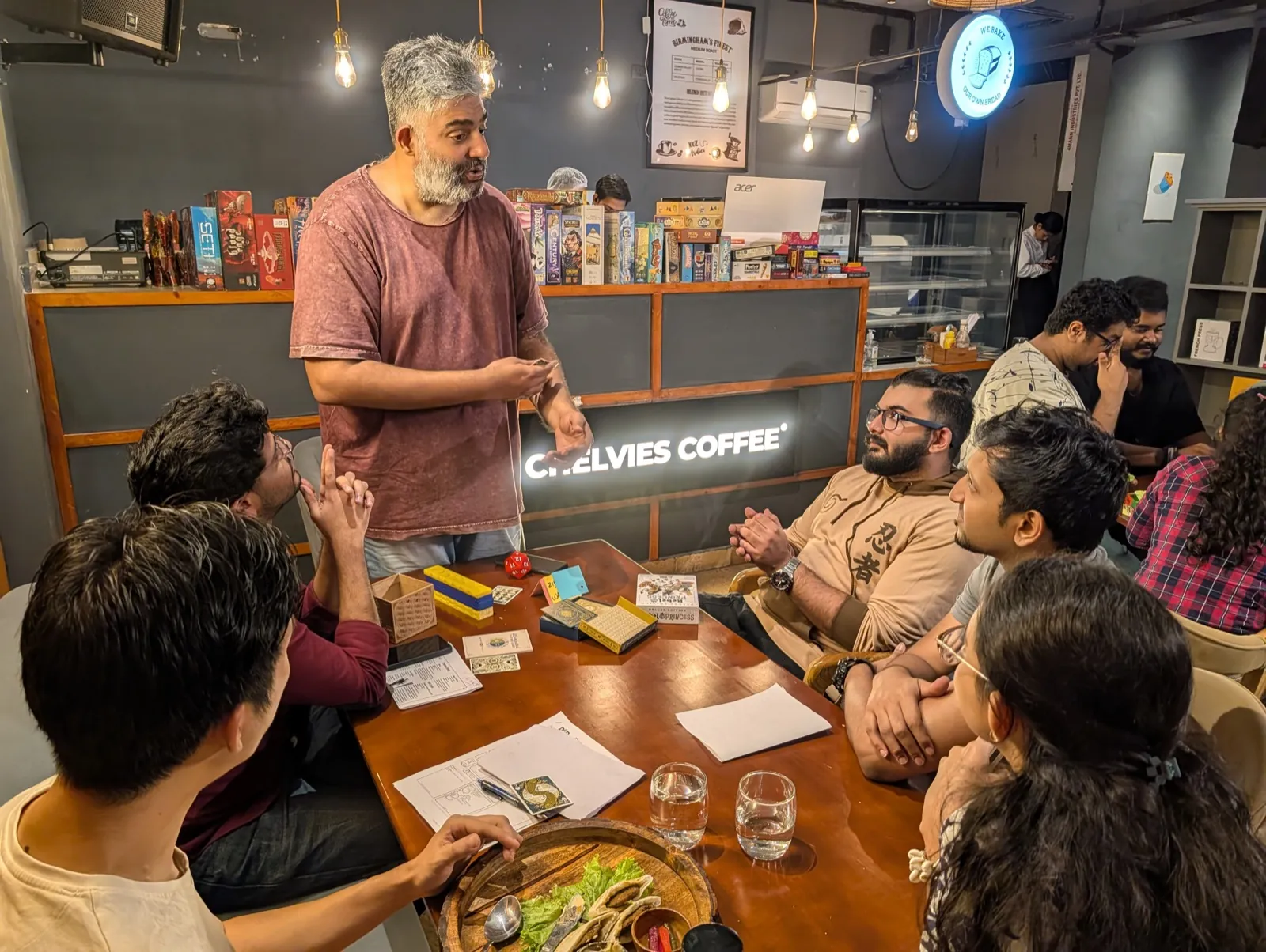Facilitator leading a board game workshop for a seated group