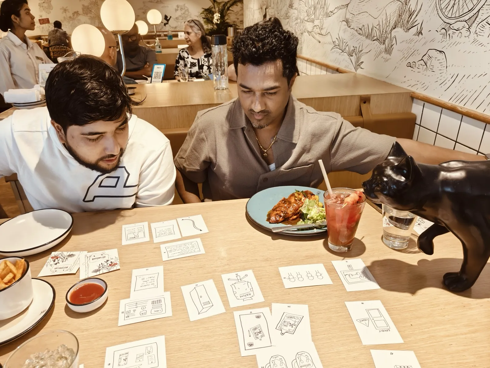 Small group playing a card game together at a casual table