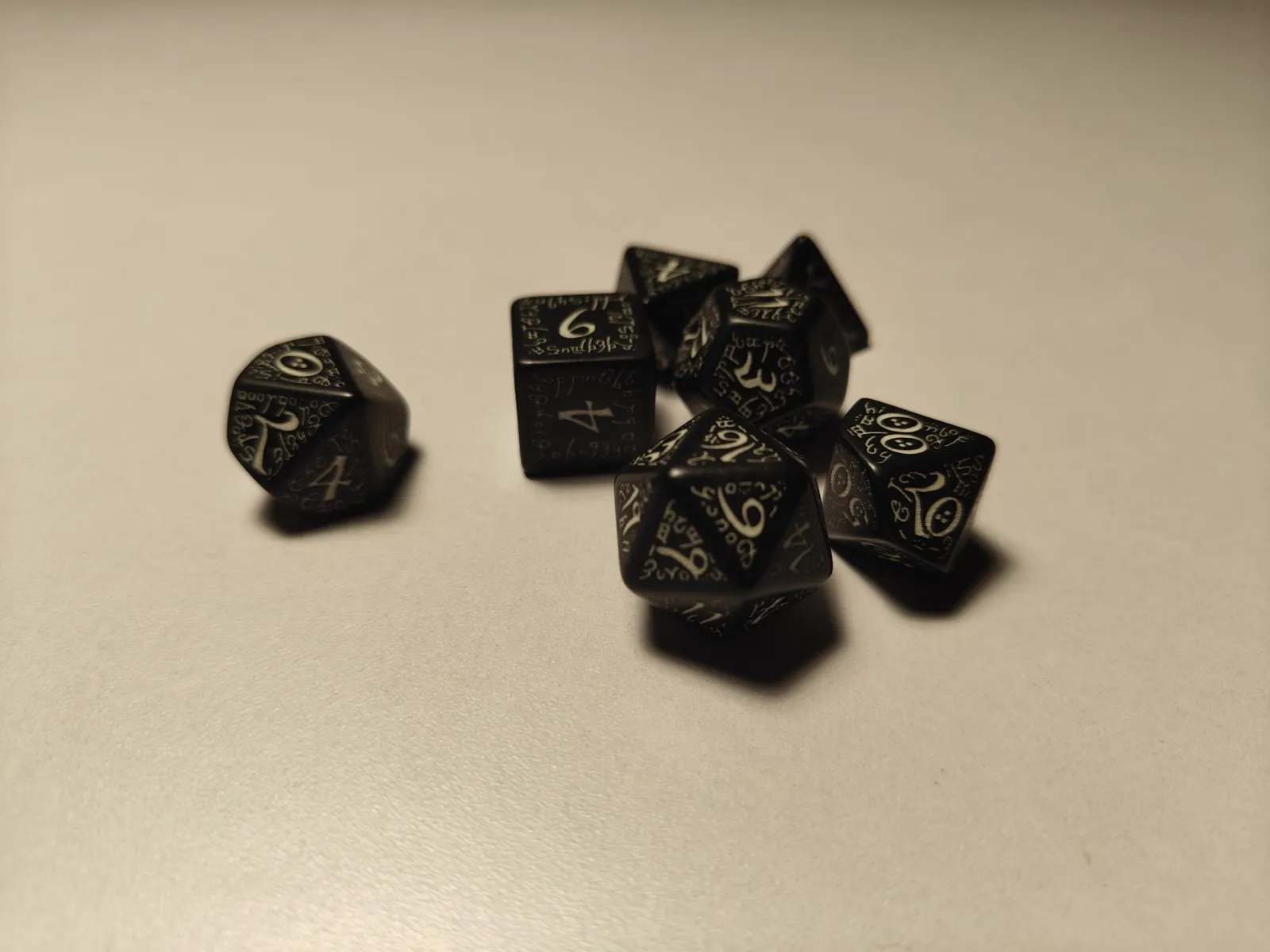 Close-up of a set of black polyhedral dice
