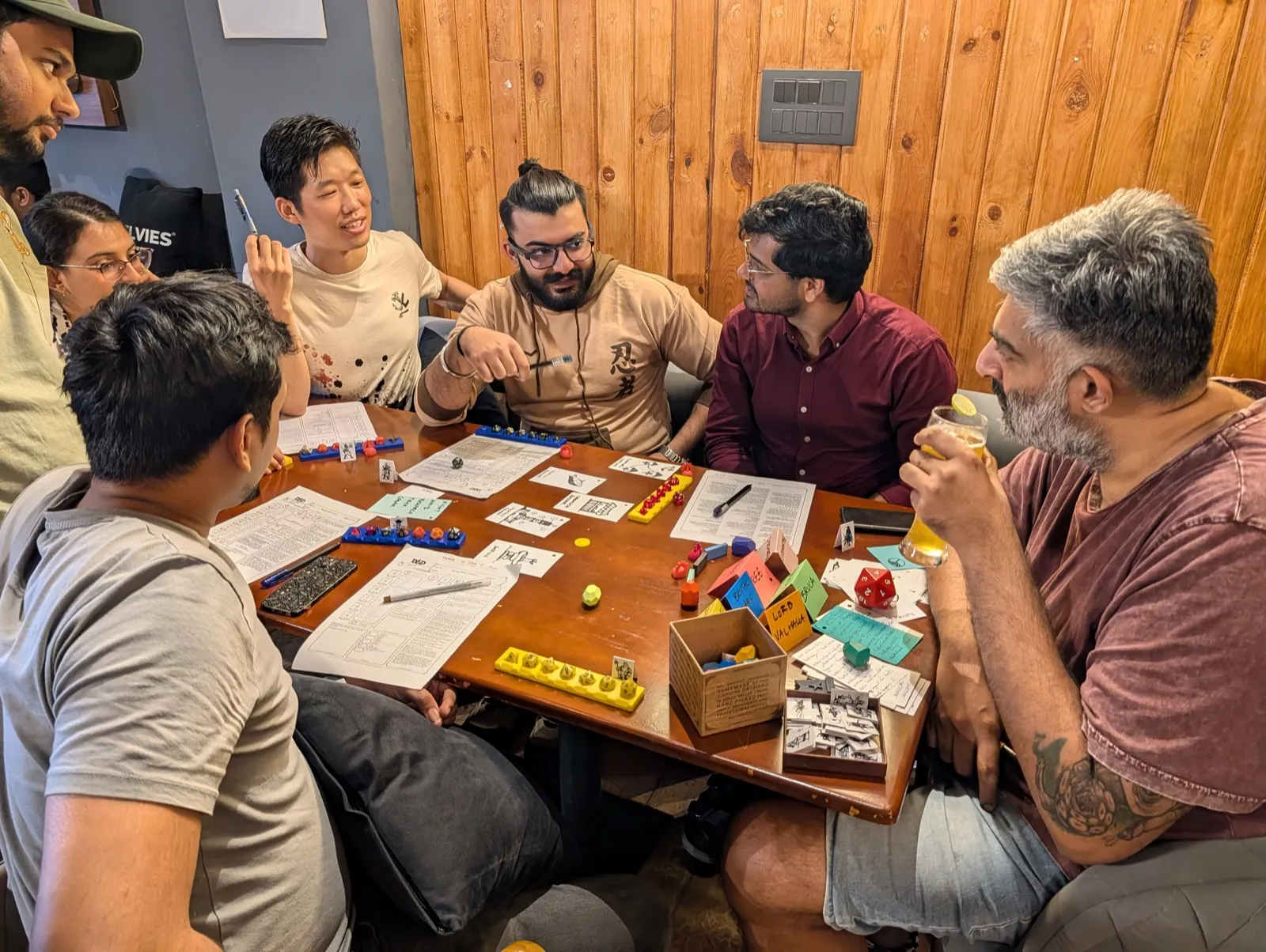 Team members reacting and celebrating during a tabletop game